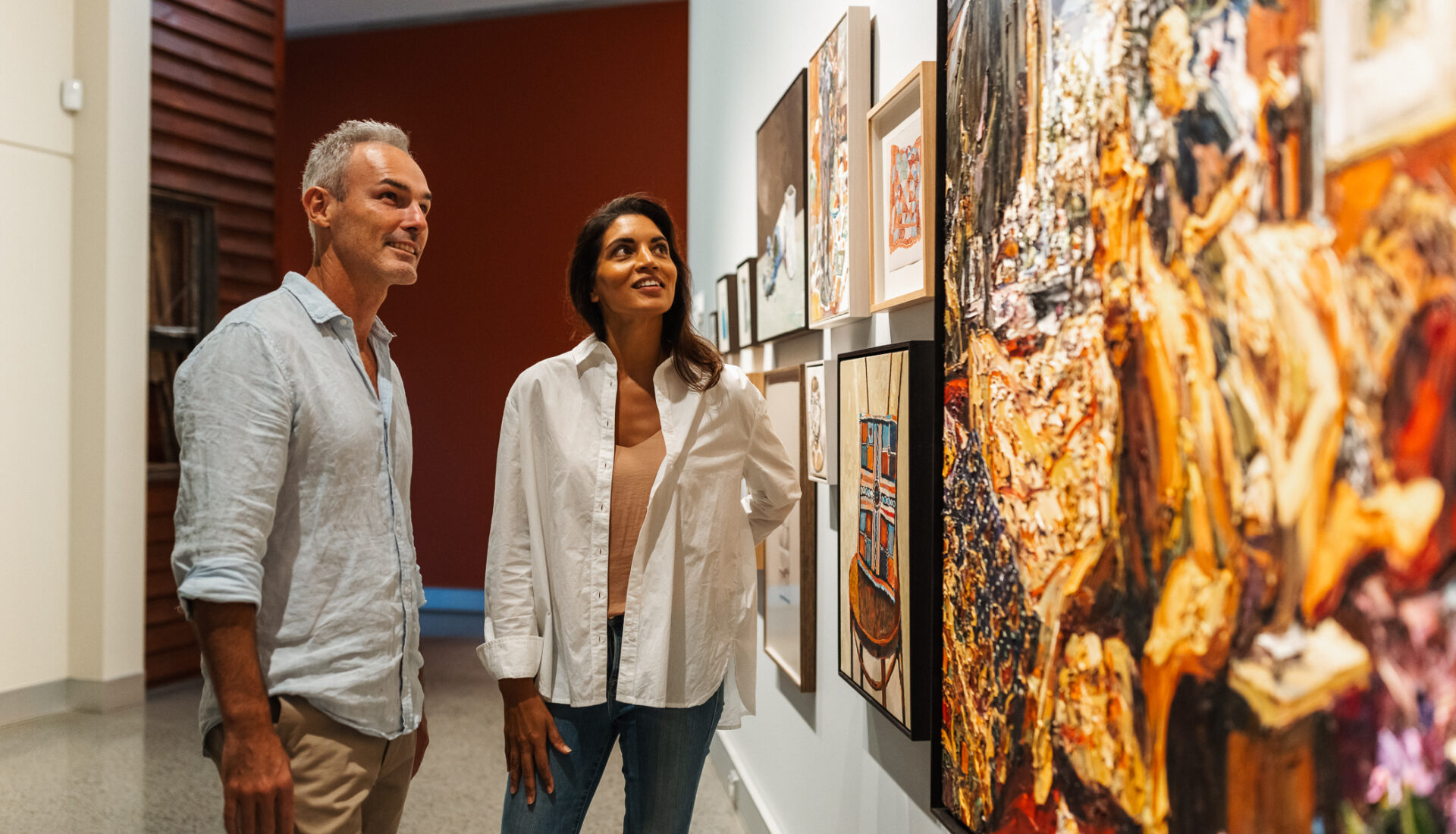 Couple view artwork in the Margaret Olley Art Centre at Tweed Regional Gallery