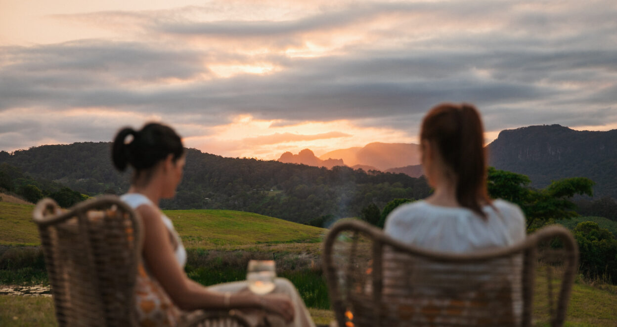 Couple enjoying view of the hinterland at Origin House Carool