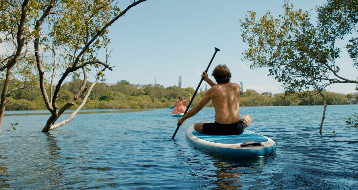 couple paddleboarding on cudgen creek