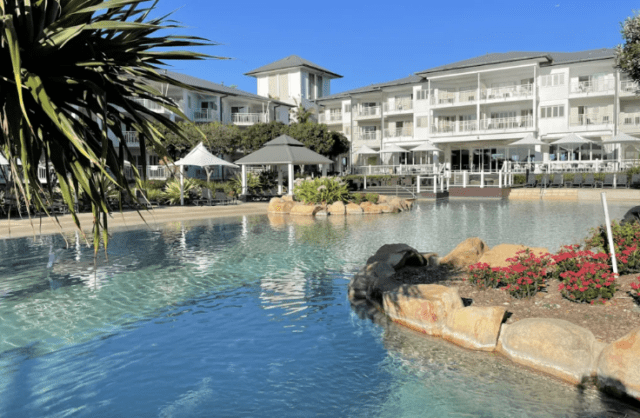 Glistening hotel pool in the radiant sunlight, offering a beautiful retreat in The Tweed.