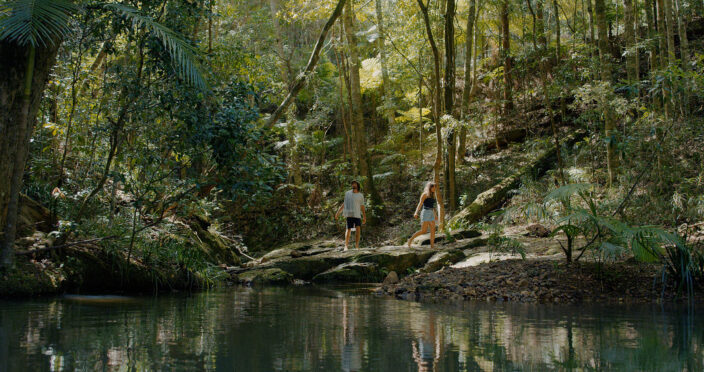 couple hiking to unicorn falls in mount jerusalem national park