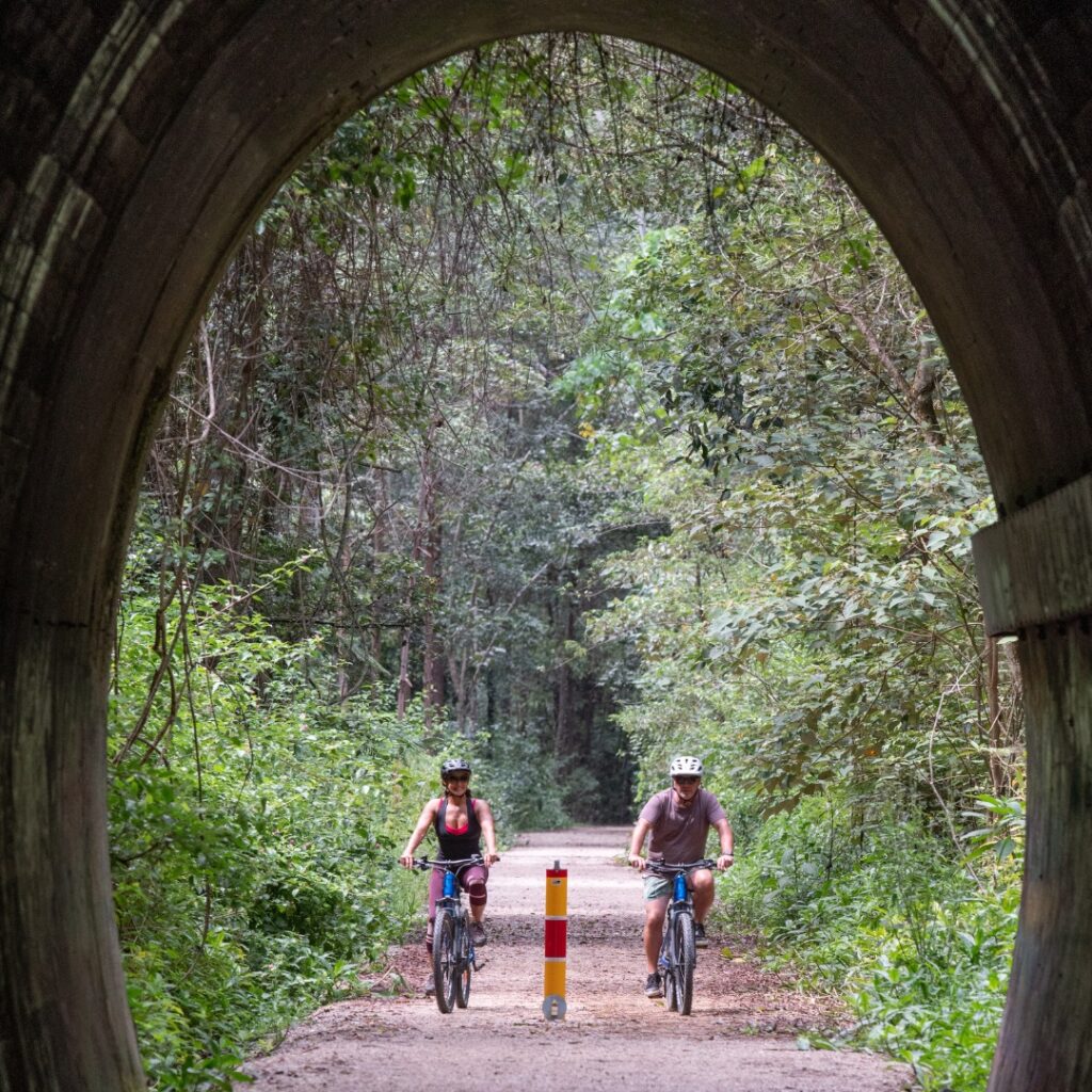 Couple entering burringbar range tunnel with Better By Bike