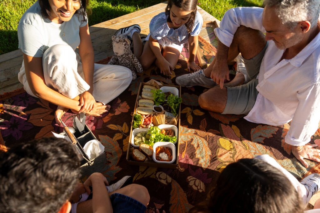 Family enjoying picnic at Farm & Co