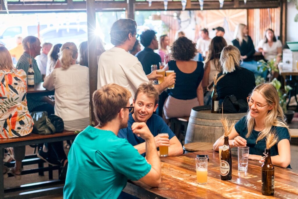 people enjoying drinks at Earth Beer Company