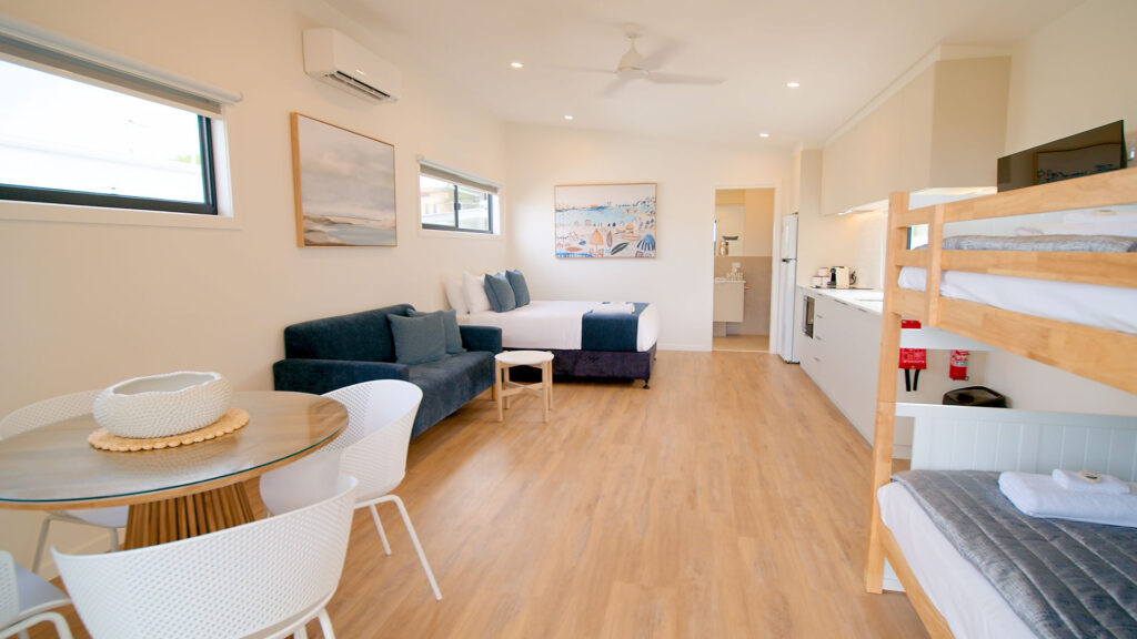 family cabin with double bed, bunk beds and stylish open plan living