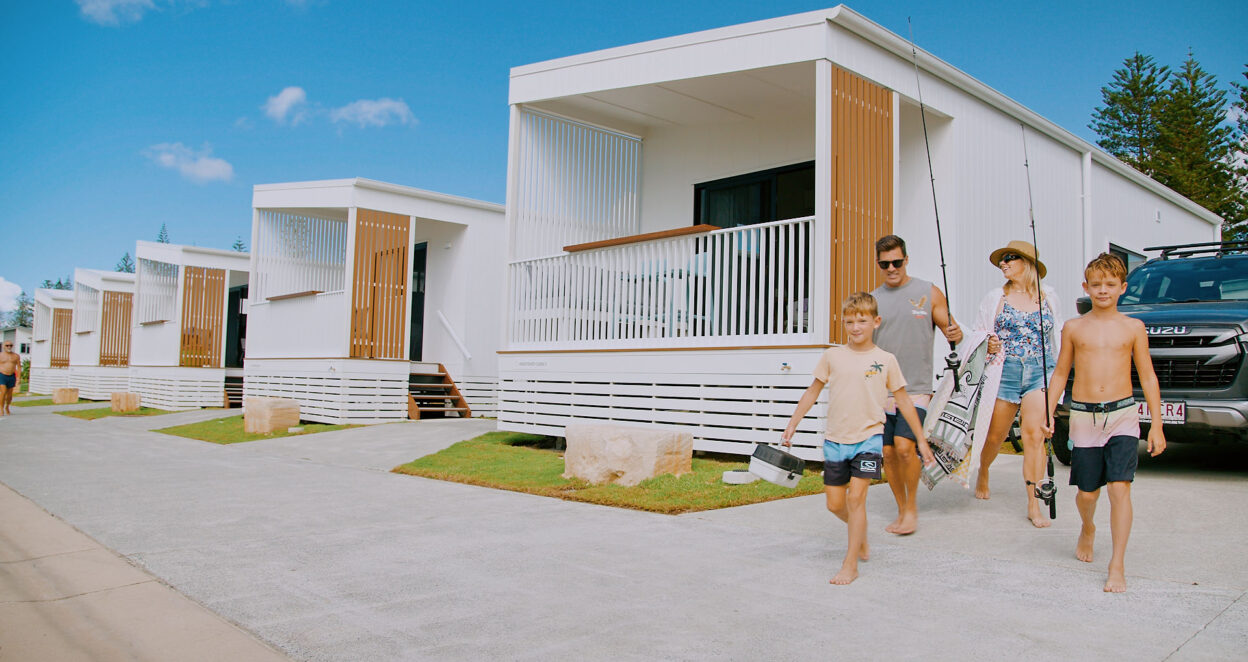 family heading to beach from tweed holiday parks kingscliff north cabin