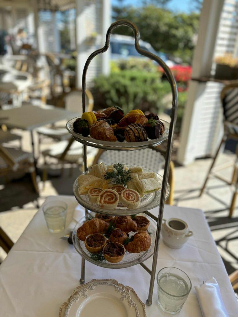High tea tower of sandwhiches and pastires at Salt Village Patisserie