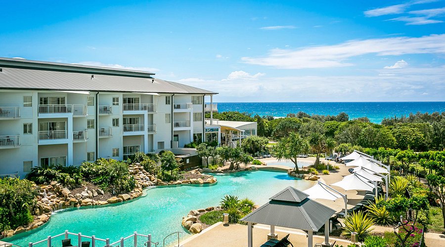 view of pool and ocean from balcony of mantra at salt beach